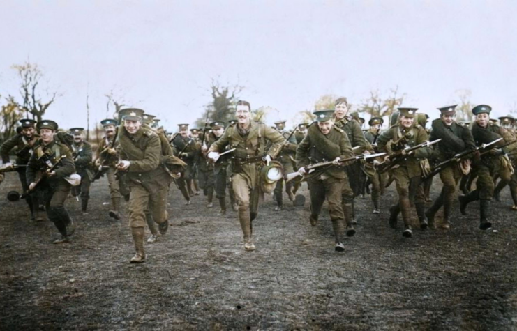 Members of the 5th Battalion (Territorial), Gloucestershire Regiment, South Midland Brigade, South Midland Division running with their weapons