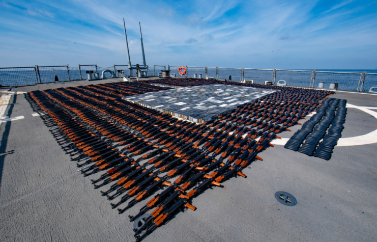 AK-47 assault rifles lined up on the USS O'Kane's flight deck