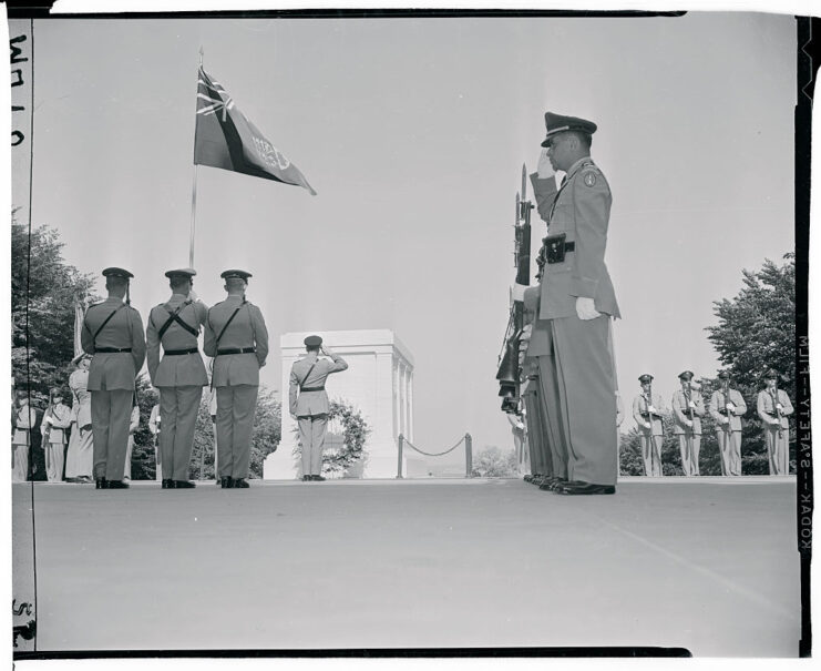 Lt. General Howard D. Graham and other military personnel standing at the Tomb of the Unknown Soldier