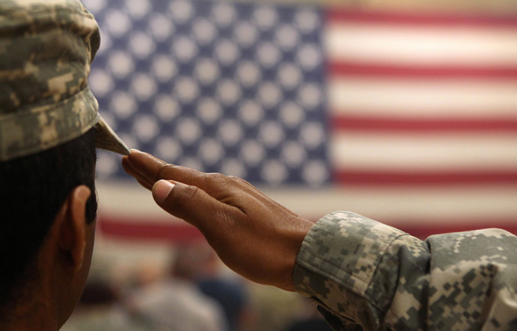 Soldier saluting the American flag