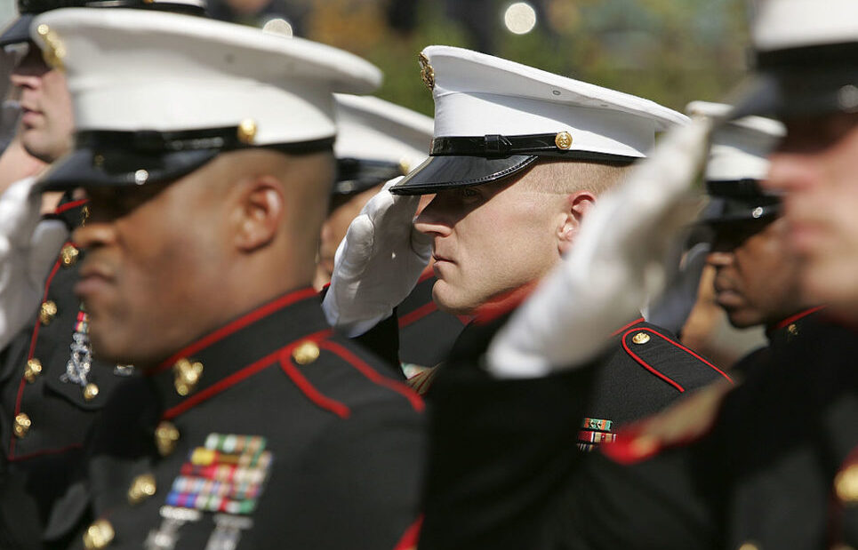 US Marines saluting in uniform