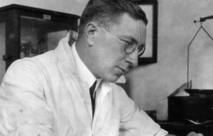 Frederick Banting working at a desk