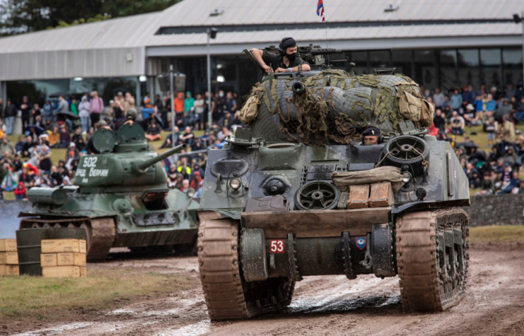 Tanks driving around a dirt track