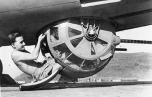 Gunner sitting in the entrance to a ball turret