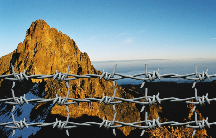 Mount Kenya with barbed wire in front.