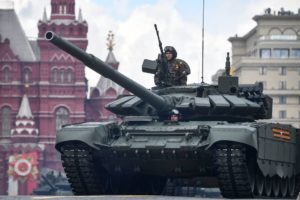 Russian soldier standing in the turret of a T-72 tank