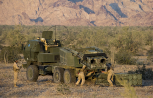 Marines loading an M142 HIMARS