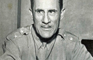 Clarence L. Tinker sitting at a desk