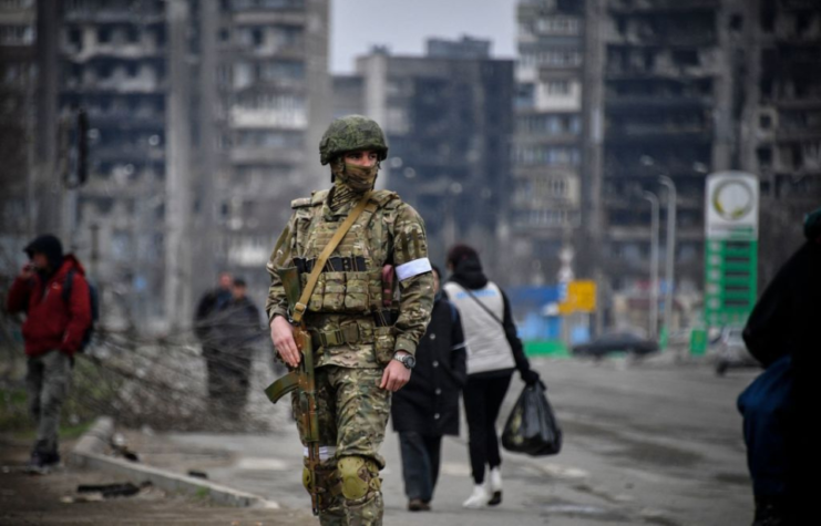 Russian soldier standing in the middle of a street