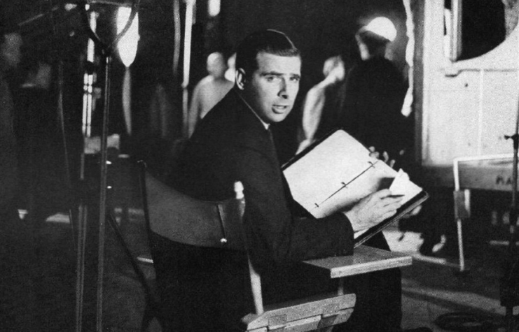 Gene Roddenberry sitting in a chair