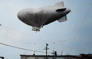 L-8 hovering above a building