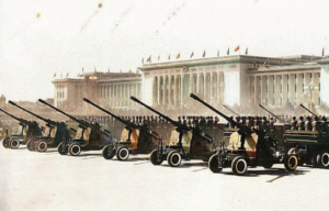 KS-19s lined up in front of a building