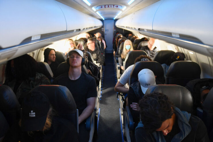 Airline passengers sitting in their seats