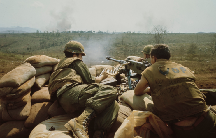 Three soldiers manning an M2 Browning .50 caliber heavy machine gun