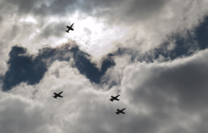 Four aircraft flying in a missing man formation