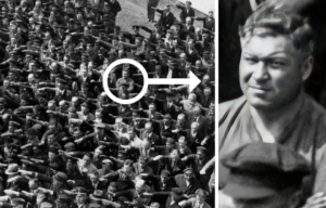 Blohm+Voss employees performing the German salute, while August Landmesser stands with his arms crossed over his chest + August Landmesser standing with his arms crossed