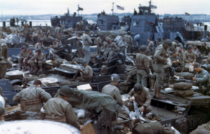 Allied soldiers standing among supplies