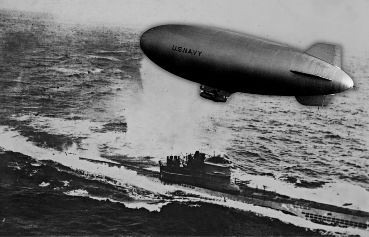 Blimp hovering over a German U-boat at sea