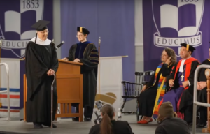 Fred Taylor walking across the stage at Cornell College's 2023 graduation ceremony