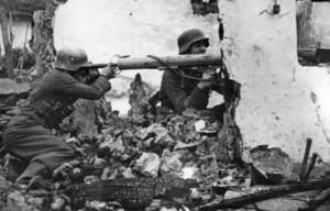 Two German soldiers manning a Panzerschreck in the rubble of a semi-collapsed building