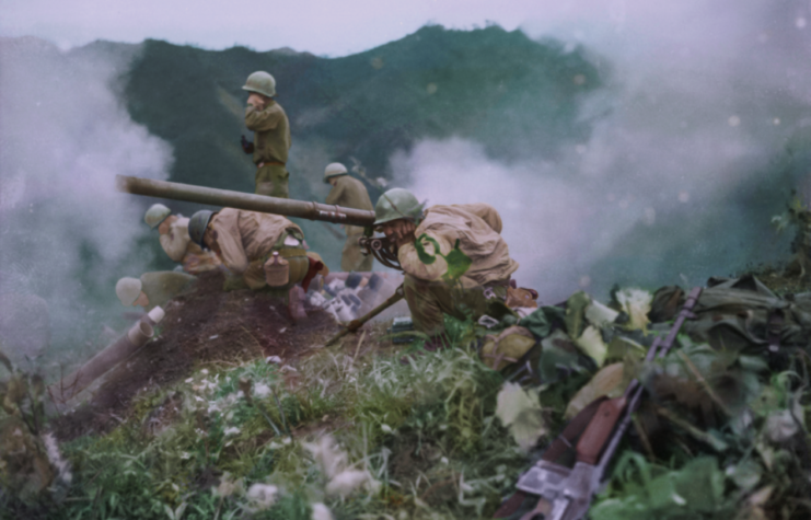 US Army soldier firing an M20 Recoilless Rifle while others cover their ears