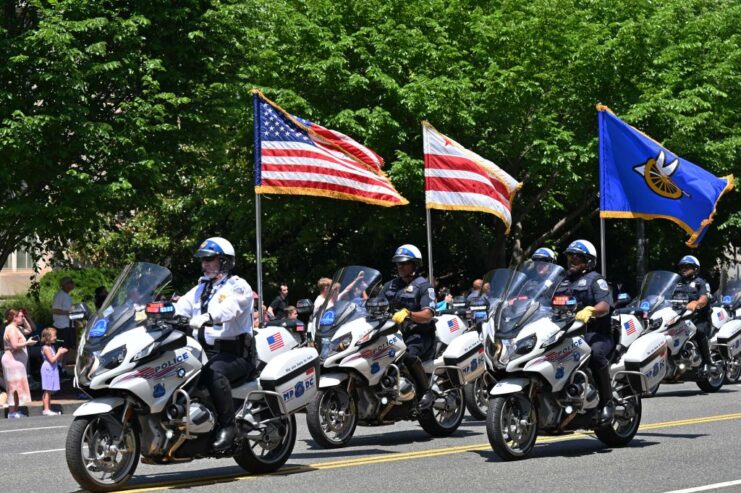 Police officers riding motorcycles in the 2022 National Memorial Day Parade