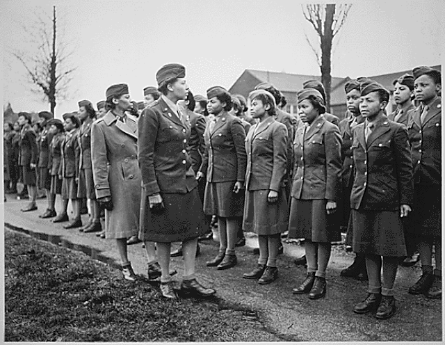 Charity Adams walking in front of members of the 6888th Central Postal Directory Battalion