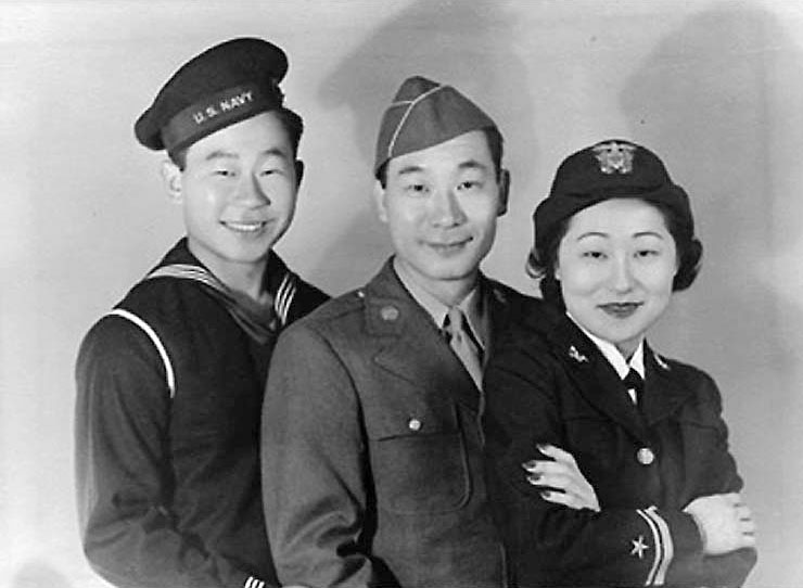 Susan Ahn Cuddy standing with her brothers, Ralph and Philip