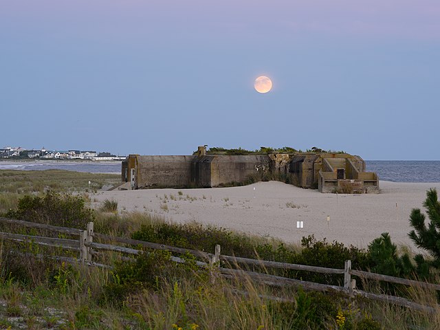View of the moon rising over Battery 223 at dusk