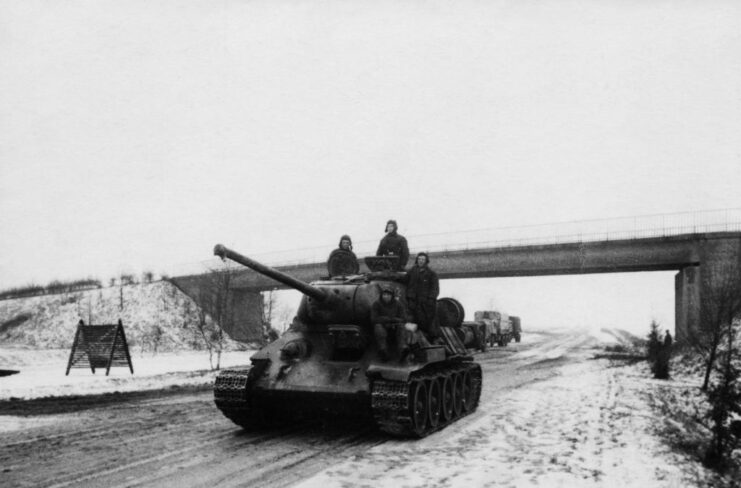 Red Army soldiers driving tanks along the Berlin Highway