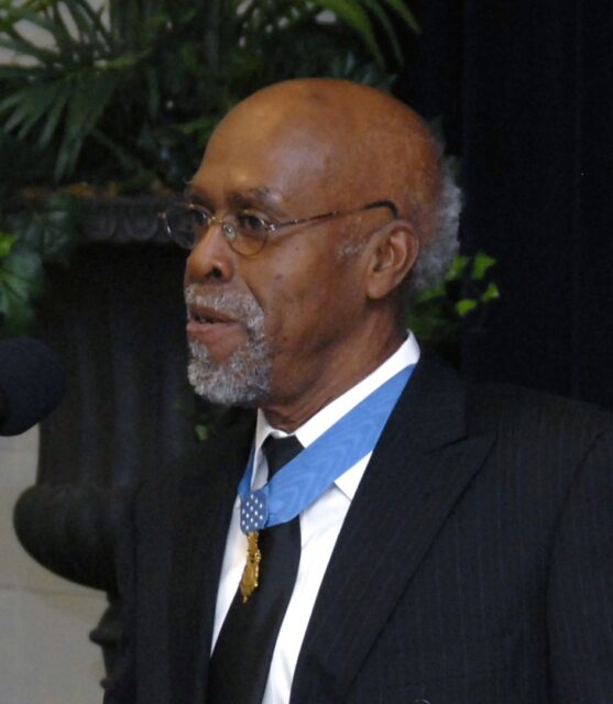 Clarence Sasser wearing a suit and his Medal of Honor