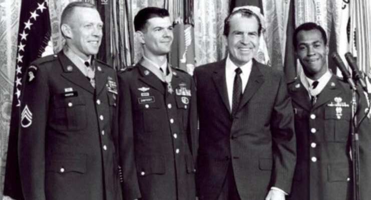 Richard Nixon standing with Clarence Sasser, Joe Hooper and Fred Zabitosky
