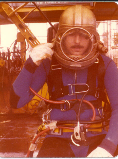 Curt Newport sitting in diving gear