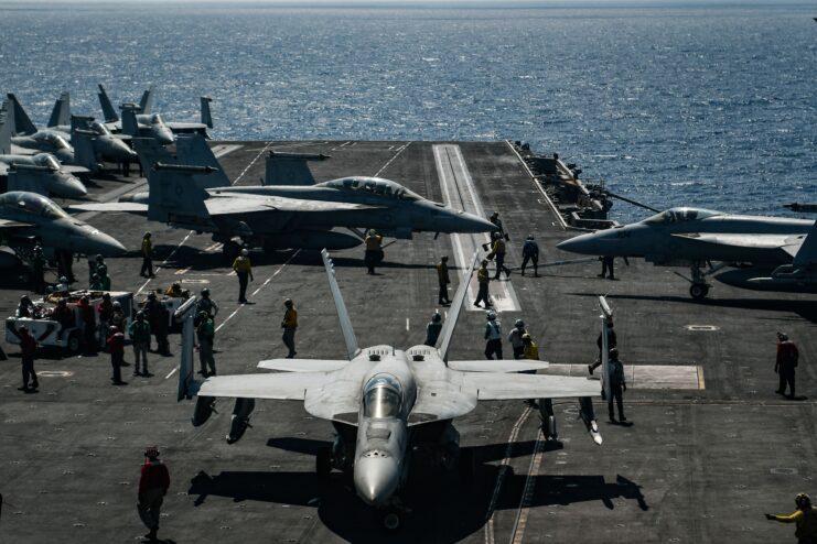 F-18 Hornet on the deck of an aircraft carrier. 