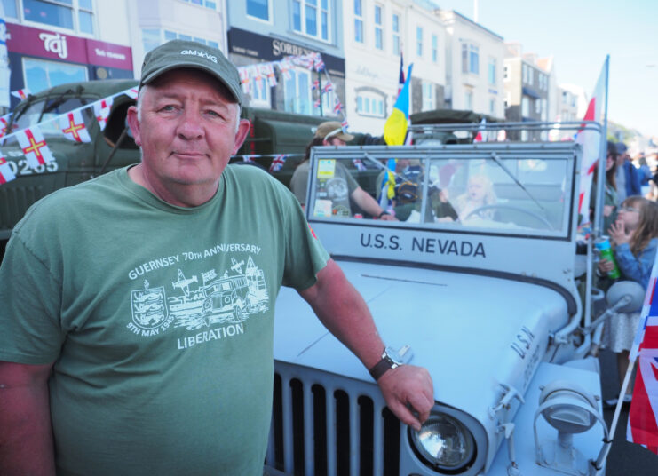 Paul Bourgaize standing next to his US Navy "Willies" Jeep