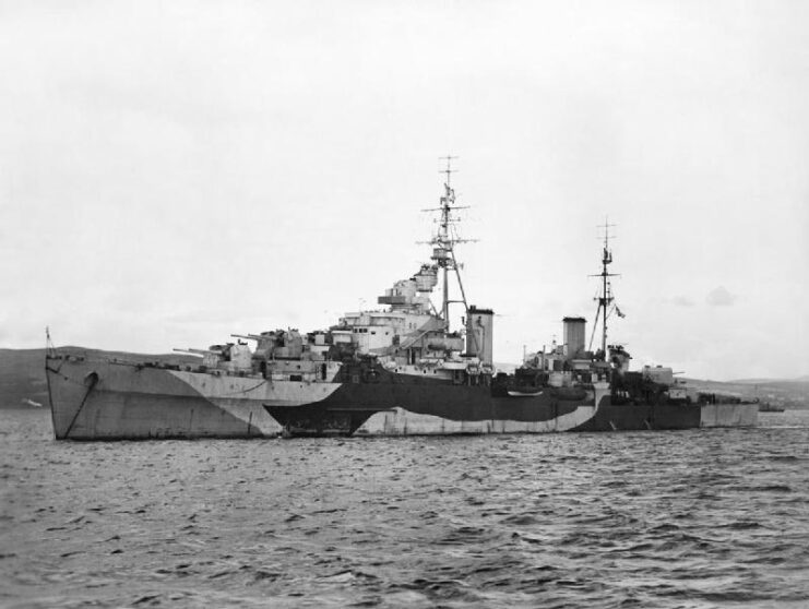 Black and white. Side view of HMS Spartan on water.