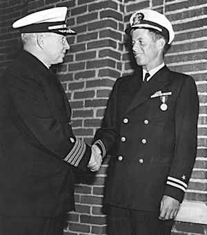 John F. Kennedy shaking hands with Frederick L. Conklin