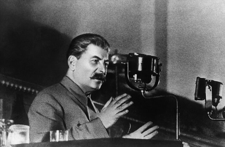 Joseph Stalin speaking at a podium