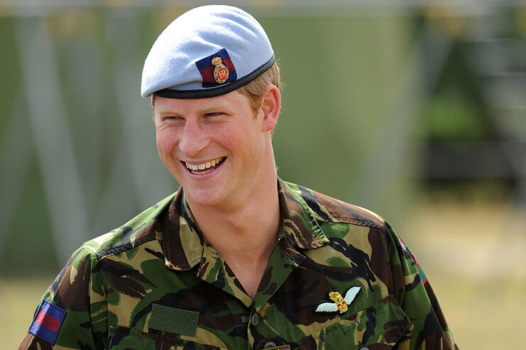 Prince Harry standing in his military fatigues