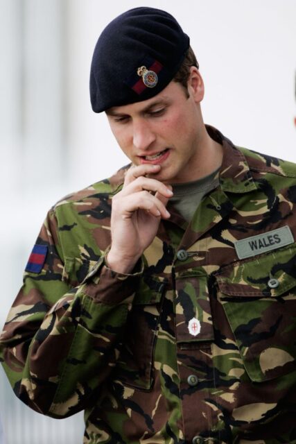 Prince William standing in his military fatigues