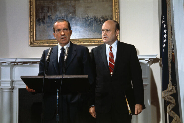 Richard Nixon standing at a podium with Melvin Laird