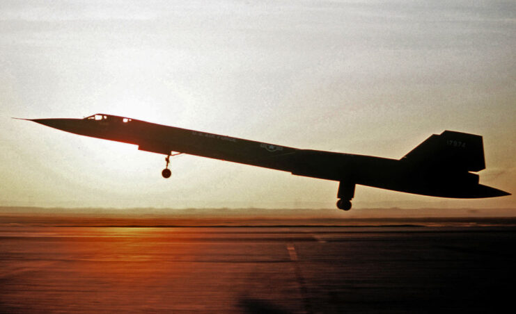 Lockheed SR-71 Blackbird landing on a runway at sunset