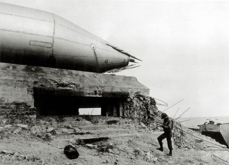 Soldier standing near a barrage balloon that's atop Widerstandsnest 72 (Wn 72)