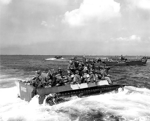 Members of the 7th Infantry Division riding in landing craft