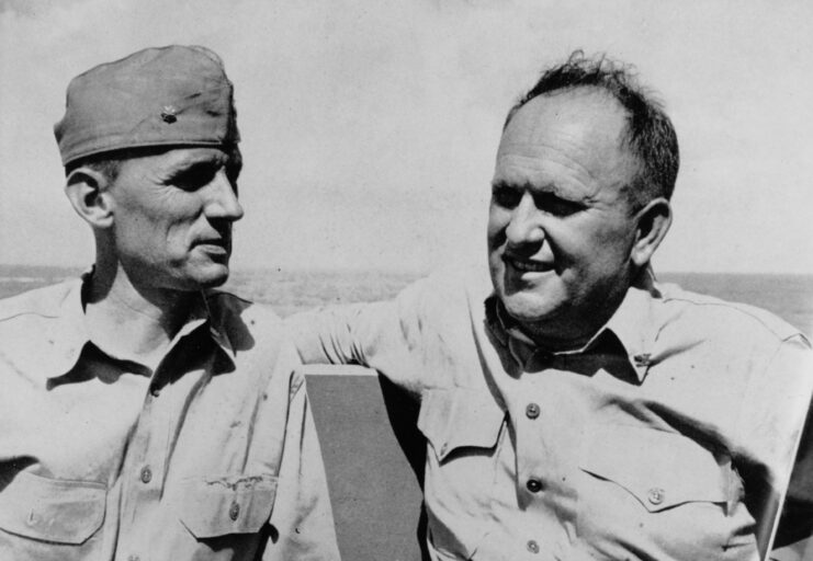 Captain Dixie Kiefer, USN, and Executive Officer, Commander William O. Burch, Jr., USN sitting together. Black and white. 