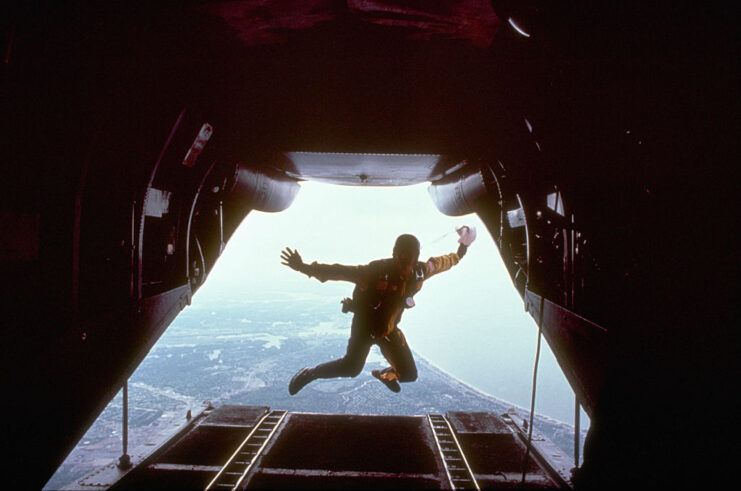 Dave Baudoin jumping out of a Boeing Vertol CH-46 Sea Knight that's in flight