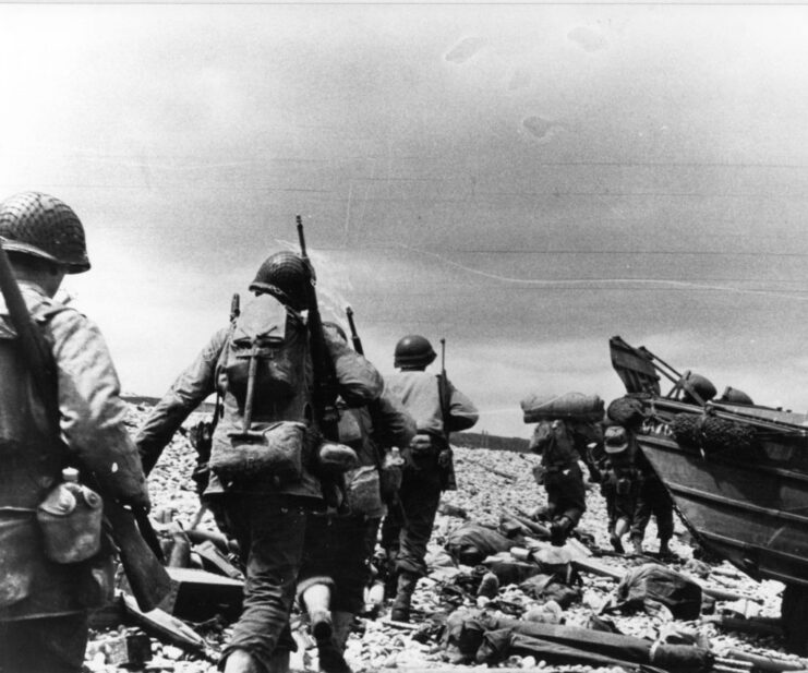 American troops running across a beach