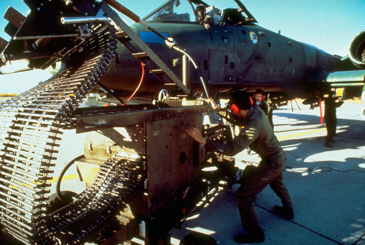 Ordnance personnel loading ammunition into the GAU-8 Avenger autocannon of a Fairchild Republic A-10 Thunderbolt II