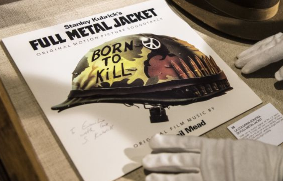 Gloved hands on the vinyl record for 'Full Metal Jacket'