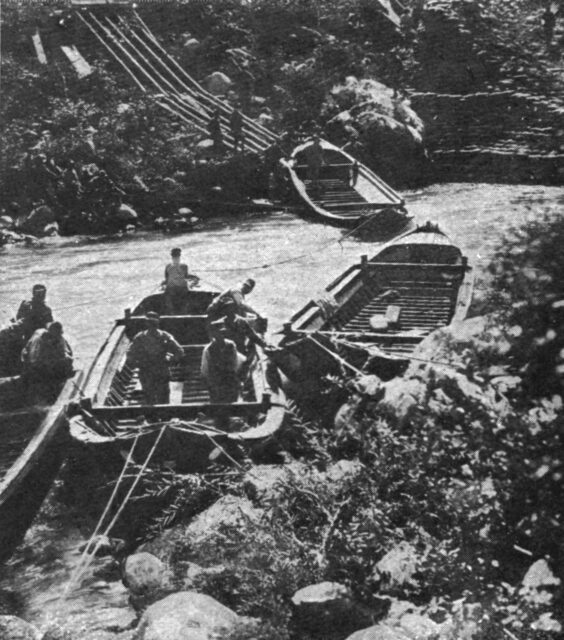 Boats being launched into a river. 